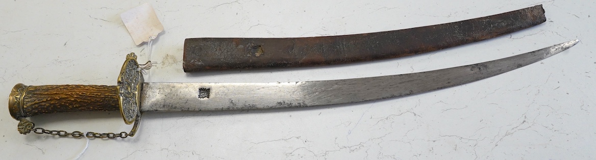 A William III English hunting hanger with pierced brass mounts, stag horn grip, blade struck with king’s head, in its leather scabbard, blade 45cm. Condition - worn, knuckle bow replaced with chain and chape missing to s